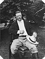 Theodore Roosevelt seated in a chair